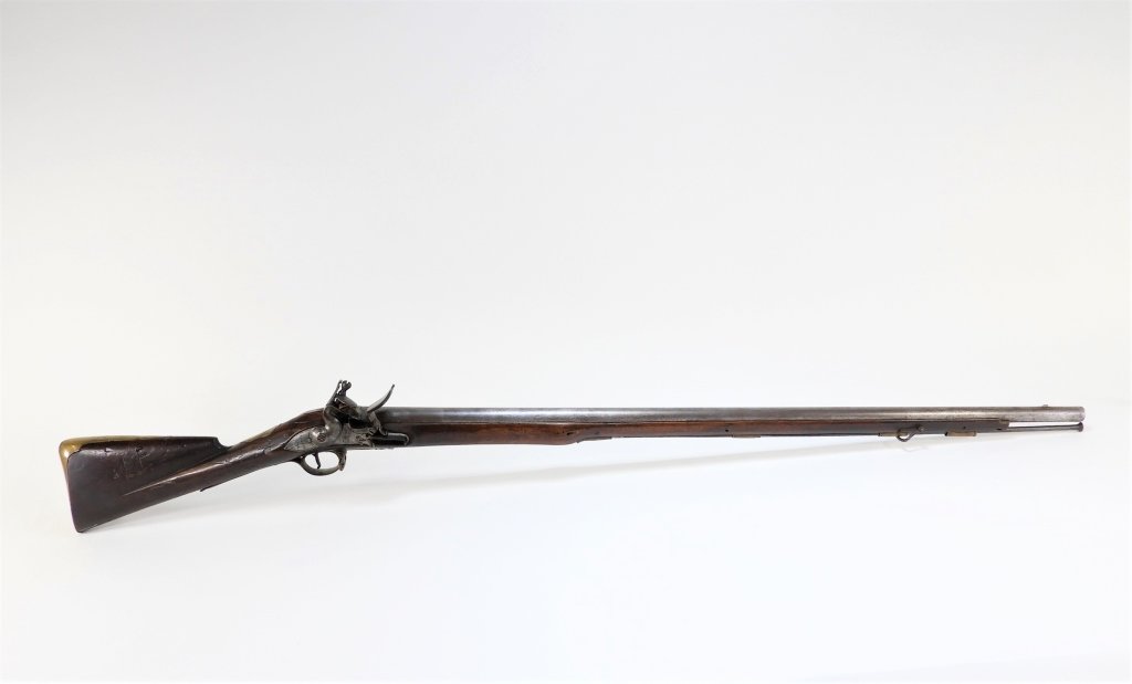 Circa 1742 long land musket, .78 bore, 57 ½ inches long, with a storekeeper’s stamp on the right side of the butt and a brass butt plate with rack number “A/18” ($23,370).